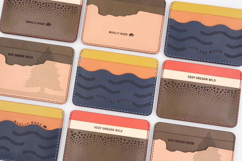 Giveback Collection Half Wallet grid with Save the Waves, Keep Forests Green, and Protect the Salmon designs.