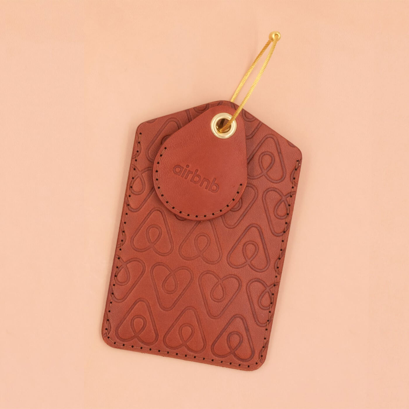 Brown leather Executive Luggage Tag with brown leather AirTag holder, brass luggage loop, and Airbnb logo