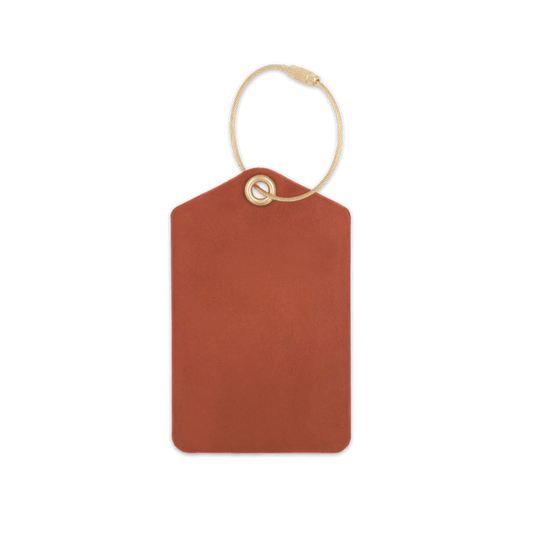 Brown leather luggage tag with brass hardware.