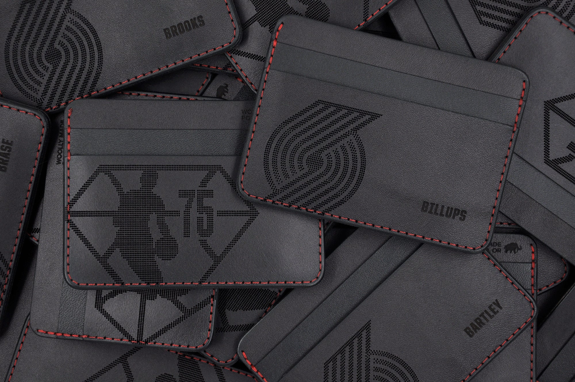 Portland Trail Blazers branded Half Wallets in black leather and red stitching.