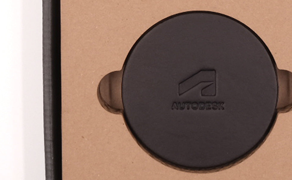 Autodesk branded Round Coasters in black leather and custom packaging.