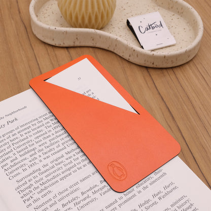 Bookmark in Orange leather with a branded deboss.