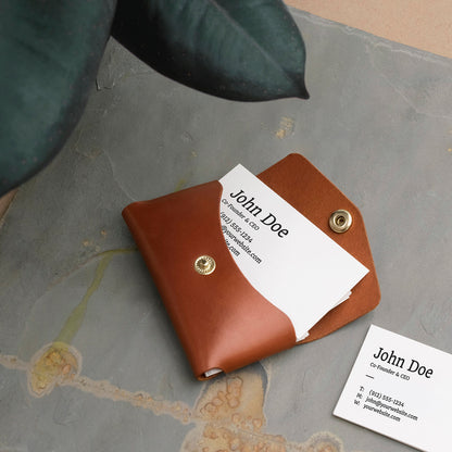 Business Card Holder in  brown leather in a lifestyle photo.