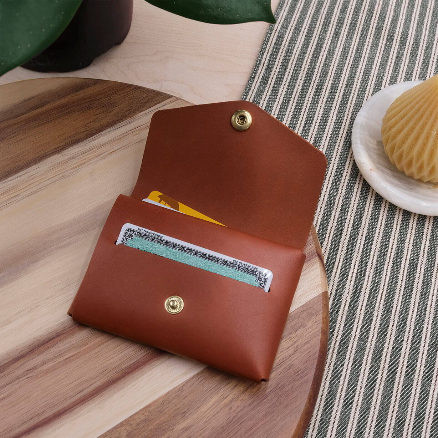 Cargo Wallet in brown leather, in a lifestyle scene.
