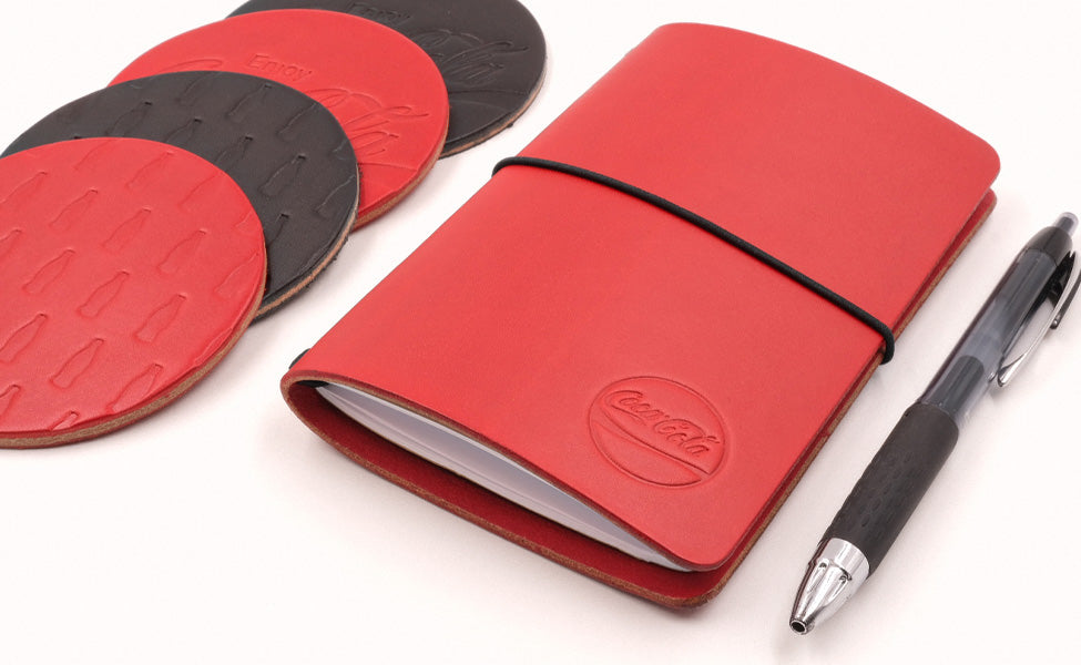 Coca-Cola branded Pocket Journal and Round Coasters in red and black leather.