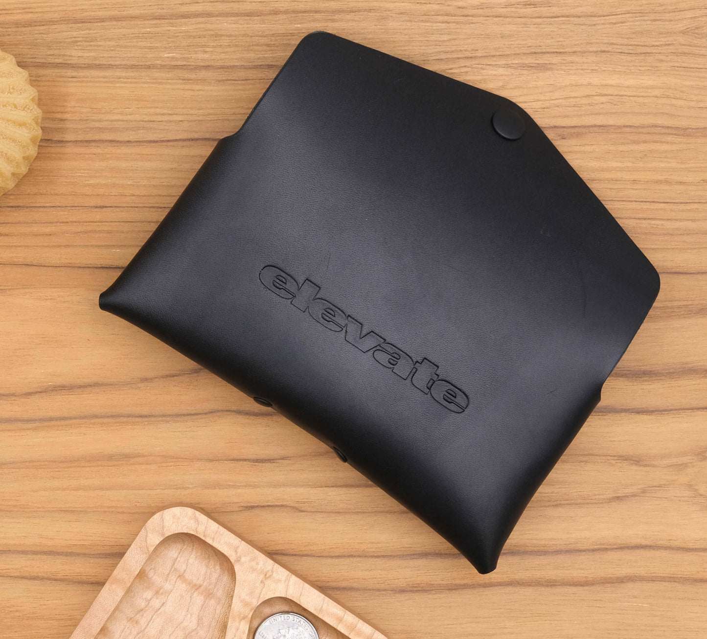 Back view of our Glasses Case in black leather in a debossed logo.