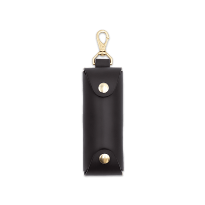 Woolly Made black leather Golf Ball Sleeve with brass hardware.