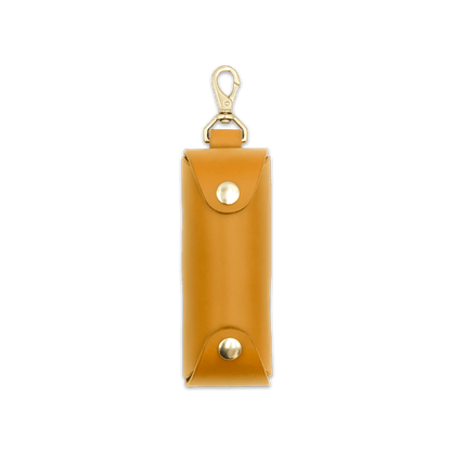 Woolly Made gold leather Golf Ball Sleeve with brass hardware.