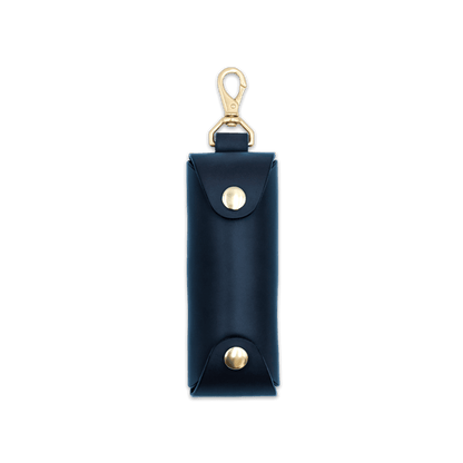 Woolly Made black leather Golf Ball Sleeve with brass hardware.