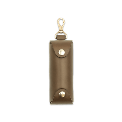 Woolly Made olive leather Golf Ball Sleeve with brass hardware.