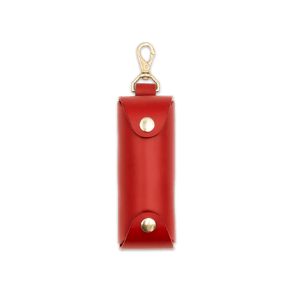 Woolly Made red leather Golf Ball Sleeve with brass hardware.