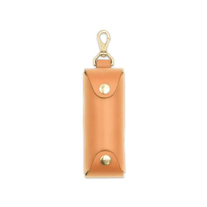 Woolly Made tan leather Golf Ball Sleeve with brass hardware.
