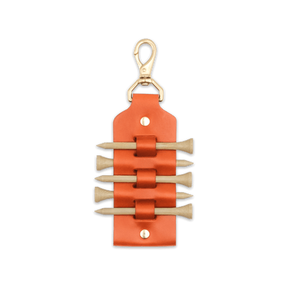 Orange leather Golf Tee Holder with 5 wood tees, and brass hardware.