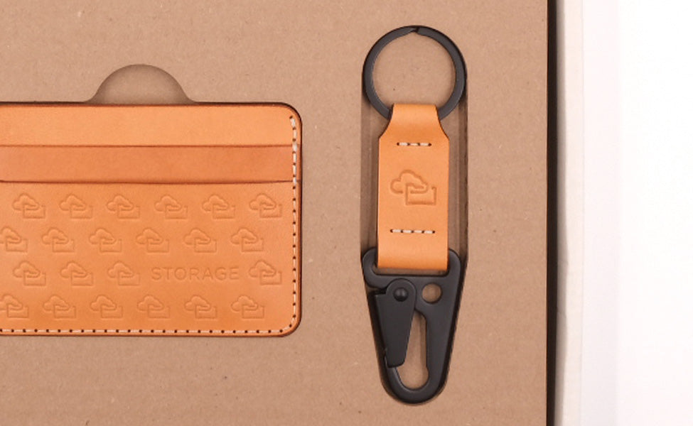 Meta Storage branded Half Wallet and Clip Keychain in tan leather plus custom packaging.