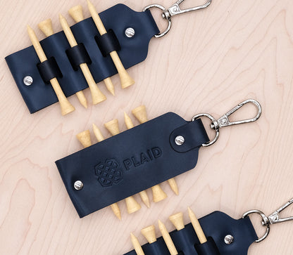 Golf Tee Tag in Navy leather with debossed logo.