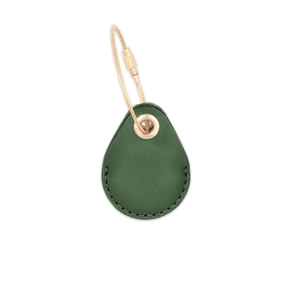 Green leather AirTag holder with brass luggage loop