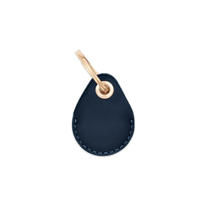 Navy leather AirTag holder with brass keychain