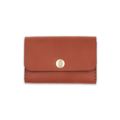 Brown leather with stitching, a fold, and brass snap closure.