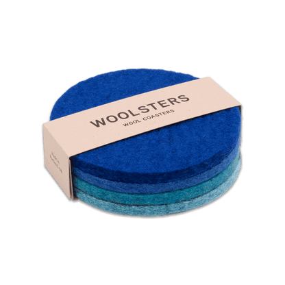 Royal blue, blue, teal, and sky blue wool round coaster mixed set stacked.