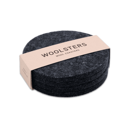 Dark gray wool round coaster set stacked.