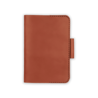 Brown leather golf scorecard holder closed view with stitching and side pencil holder.