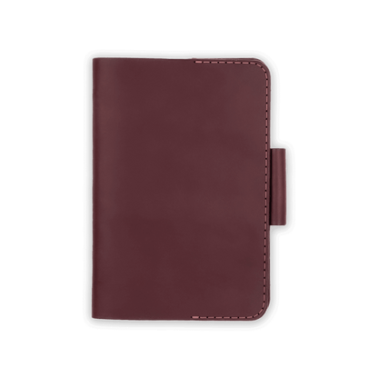 Burgundy leather golf scorecard holder closed view with stitching and side pencil holder.