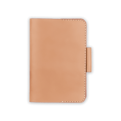 Natural leather golf scorecard holder closed view with stitching and side pencil holder.