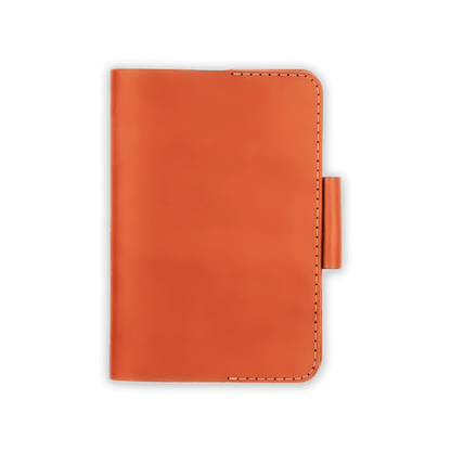 Orange leather golf scorecard holder closed view with stitching and side pencil holder.