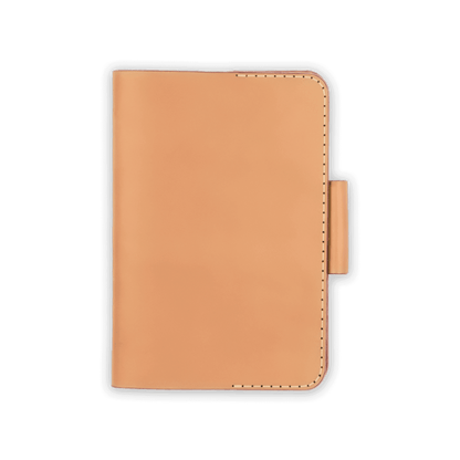 Tan leather golf scorecard holder closed view with stitching and side pencil holder.