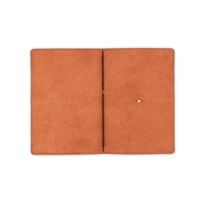 Brown glazed leather journal cover open view with elastic strap.