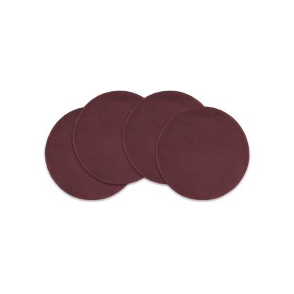 Burgundy leather round coasters spread out