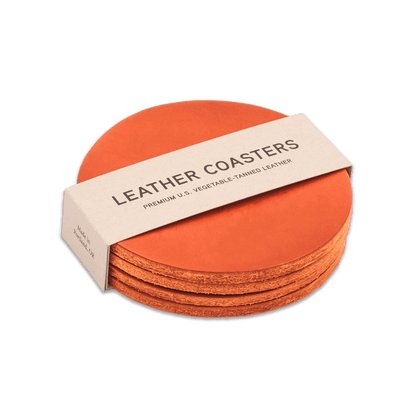 Orange leather round coasters set