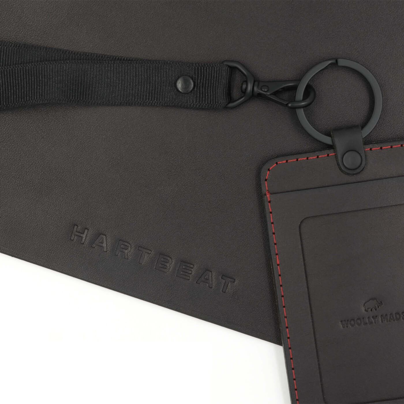 Black Mouse Pad with Black ID Badge Holder, red stitching, black hardware and lanyard, and Hartbeat logo