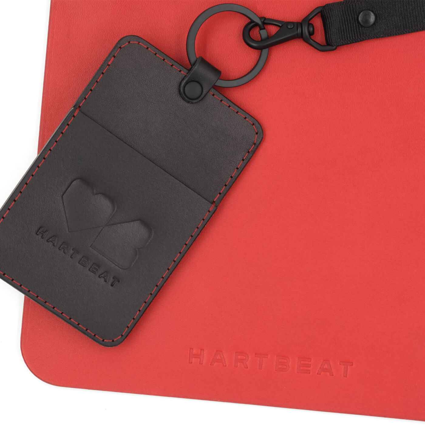 Red leather Mouse Pad with Black ID Badge Holder, red stitching, black hardware and lanyard, and Hartbeat logo