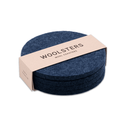 Navy wool round coaster set stacked.