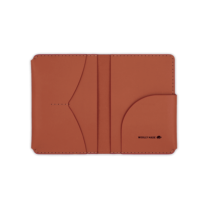 Brown leather passport wallet open view with Woolly Made logo.