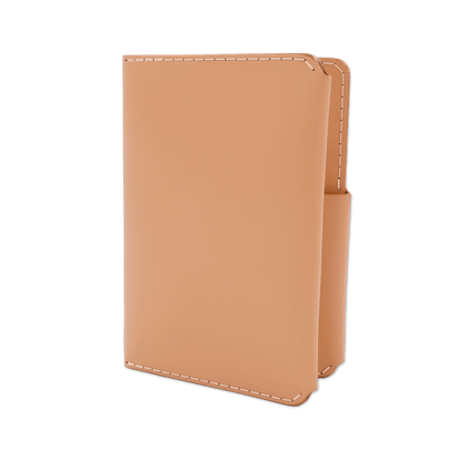 Natural leather passport wallet 3/4 angle view.