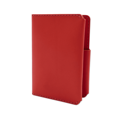 Red leather passport wallet 3/4 angle view.