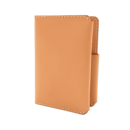 Tan leather passport wallet 3/4 angle view.