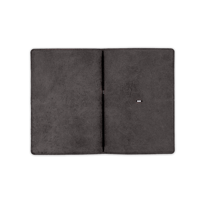 Black glazed leather journal cover open view with elastic strap.