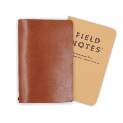 Brown glazed leather journal cover closed view with Field Notes notebook.