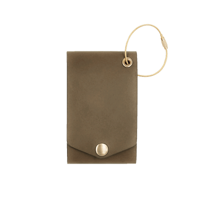 Olive leather luggage tag with fold closure and brass hardware.