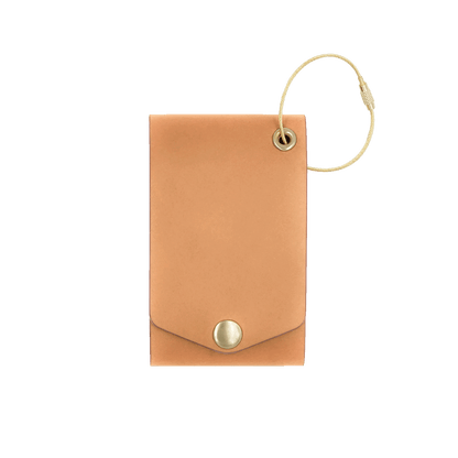 Tan leather luggage tag with fold closure and brass hardware.