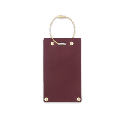 Burgundy leather rectangular luggage tag front view with brass hardware.