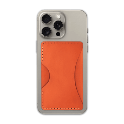 Orange leather Stick-On Wallet on iPhone.