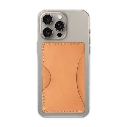 Tan leather Stick-On Wallet on iPhone.