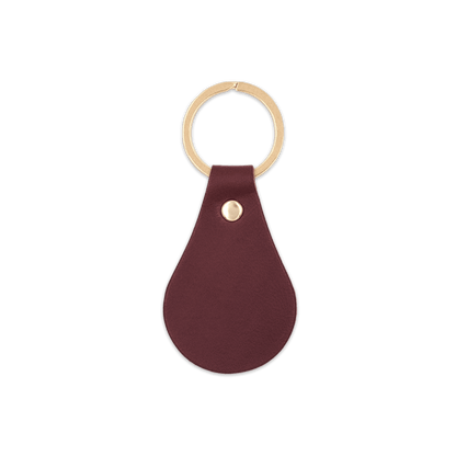 Burgundy leather teardrop-shaped keychain with brass hardware.