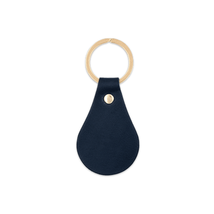 Navy leather teardrop-shaped keychain with brass hardware.