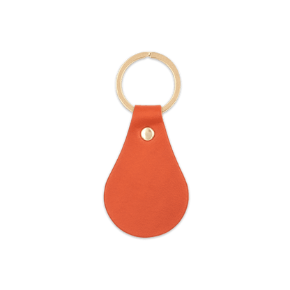 Orange leather teardrop-shaped keychain with brass hardware.