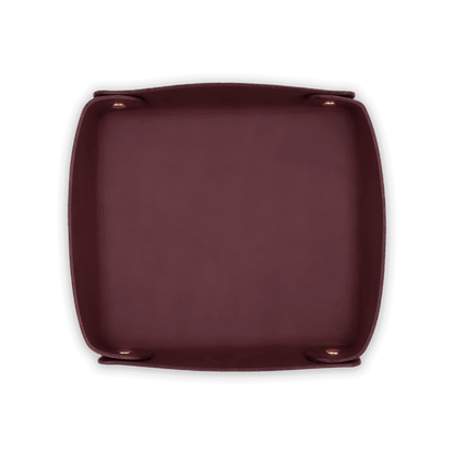 Burgundy leather valet tray top down view with brass hardware.